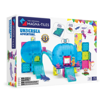 The Original Magna-Tiles Undersea Adventure toy set in its retail box, featuring a colorful underwater construction scene with blue domes, sharks, fish, and sea creatures on a white background.